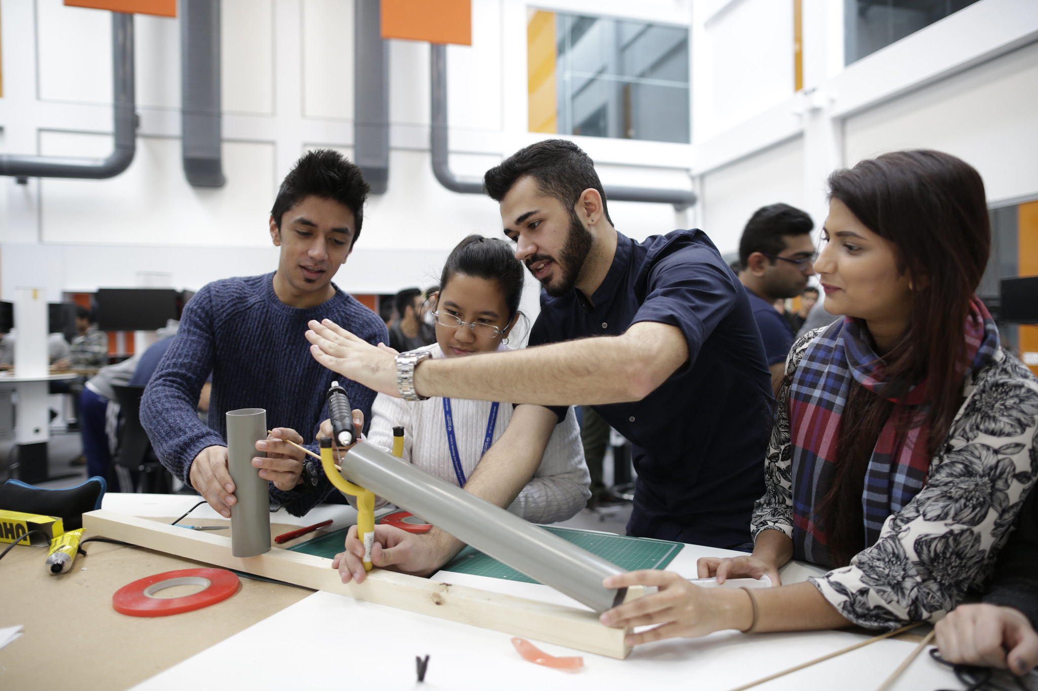 Teacher and students in a workshop