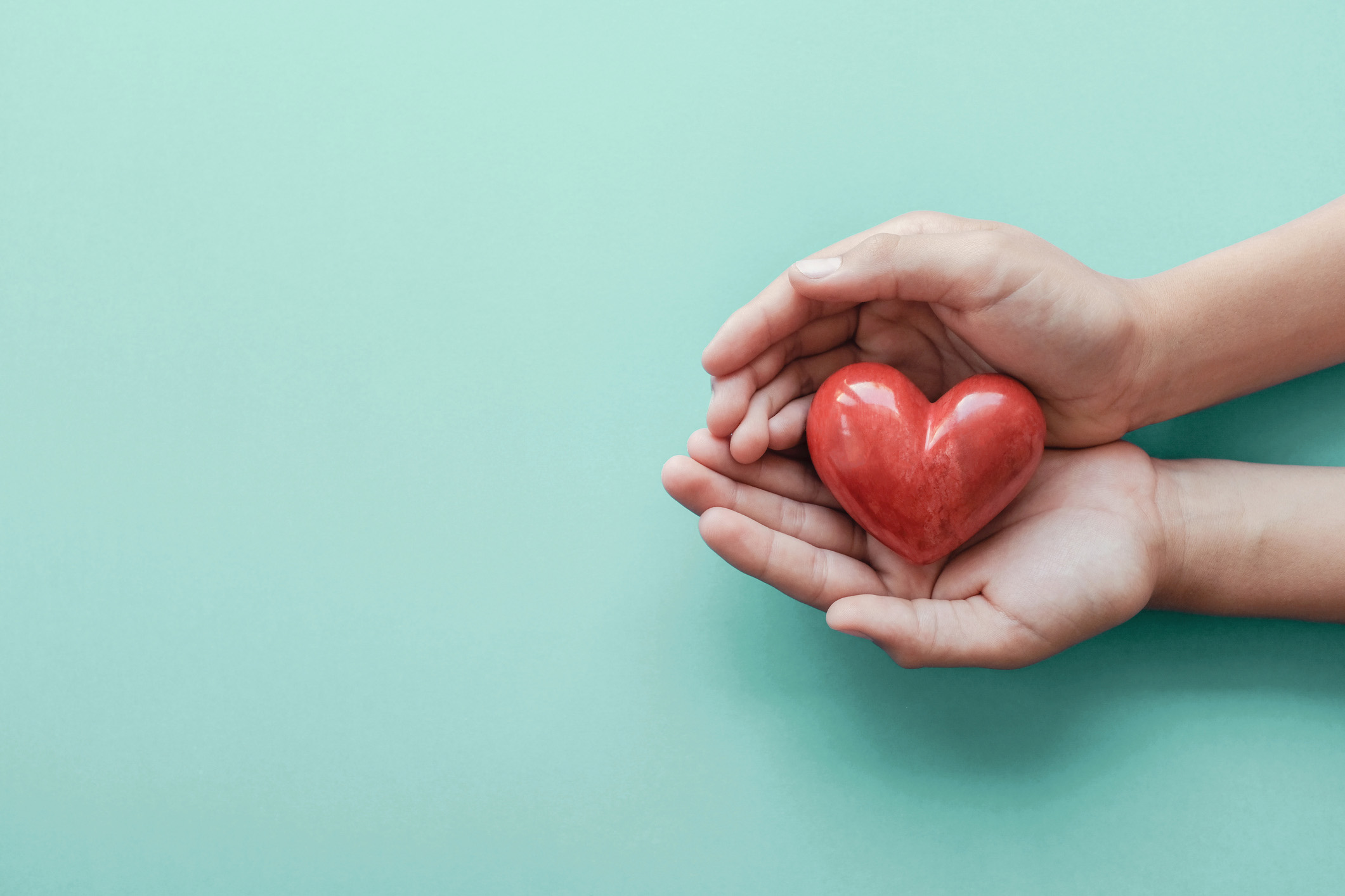 Hands cupping a heart