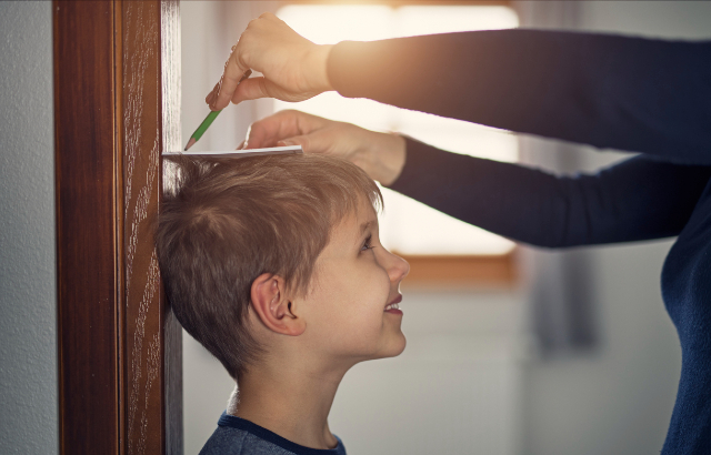 Parent measuring child's height