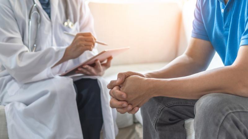 Doctor consults with male patient