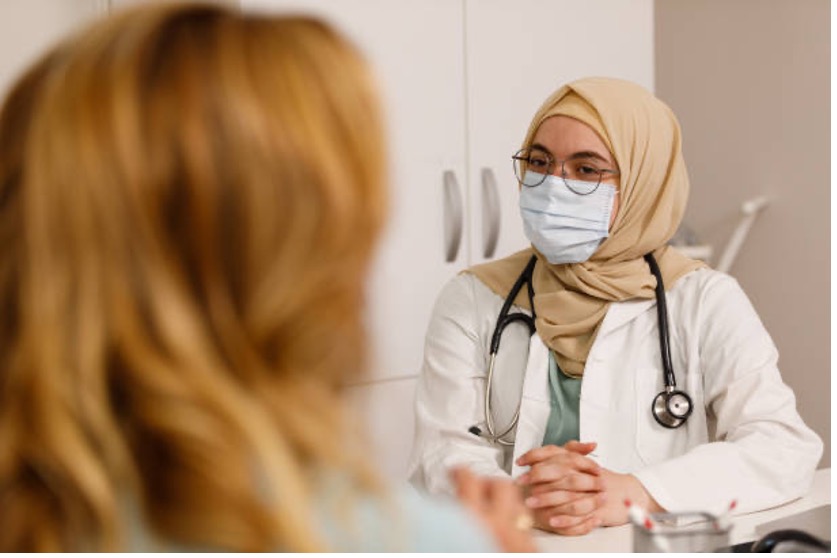 A doctor talking to a patient